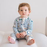 Baby wearing the ZIPSTER x Miffy Peek-a-Boo Blue bamboo babygrow